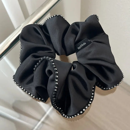 Stylish Hair Accessories: A variety of satin elastic hair ties, rhinestone headbands.